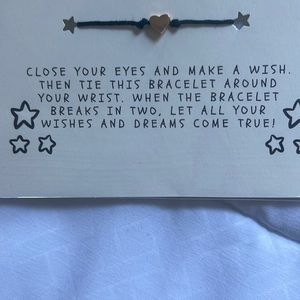 String bracelet with gold heart charm